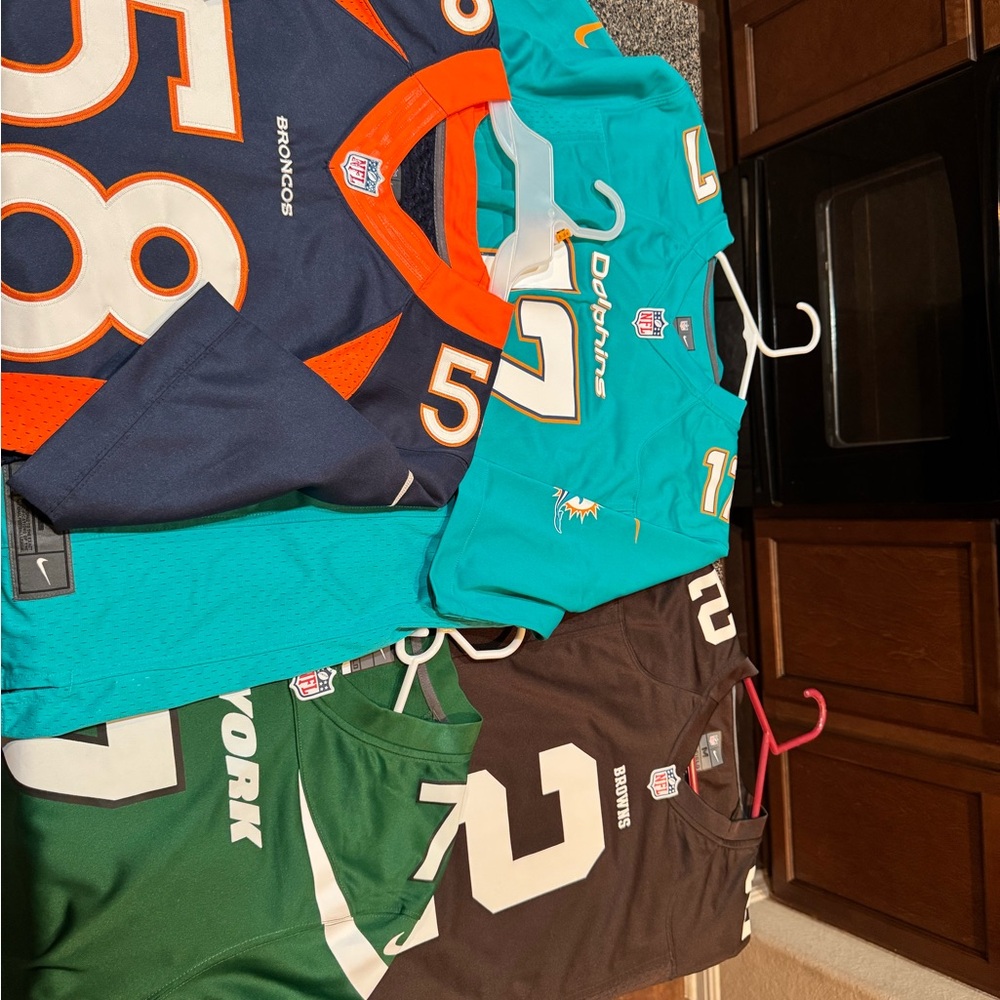 Vintage NFL Texas A&M Aggie alumni jerseys.